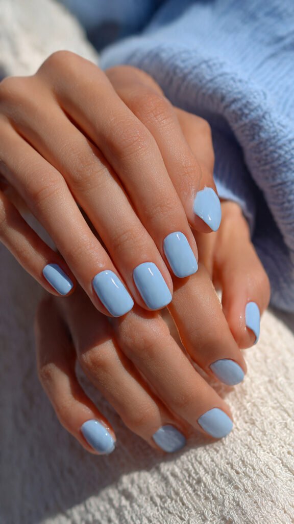 close-up-of-hands-with-baby-blue-minimal-nails-def