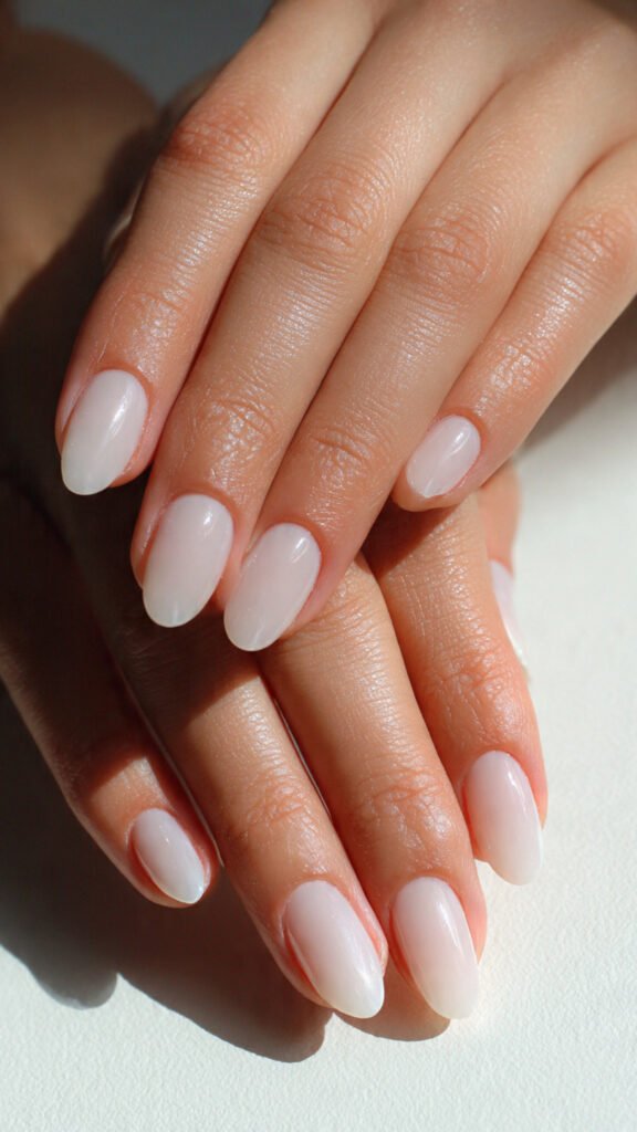 close-up-of-hands-with-milky-white-nails-soft-semi
