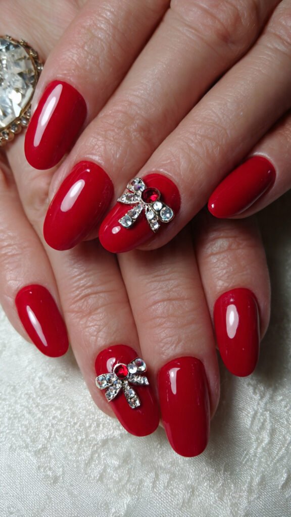 red-nails-with-3d-details-raised-elements-like-bow