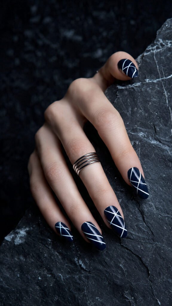 navy blue and white geometric contrast nails