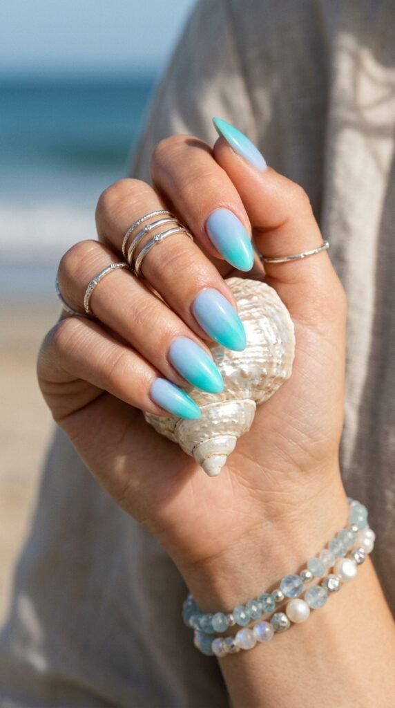 Blue_aura_nails_holding_seashell Blue_aura_nails_holding_seashell