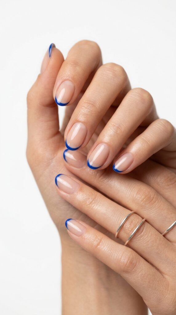 Feminine_hands_with_blue_Frenchtips Feminine_hands_with_blue_Frenchtips