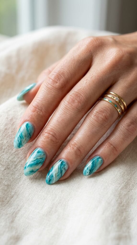 Teal_marble_nails_with_rings Teal_marble_nails_with_rings